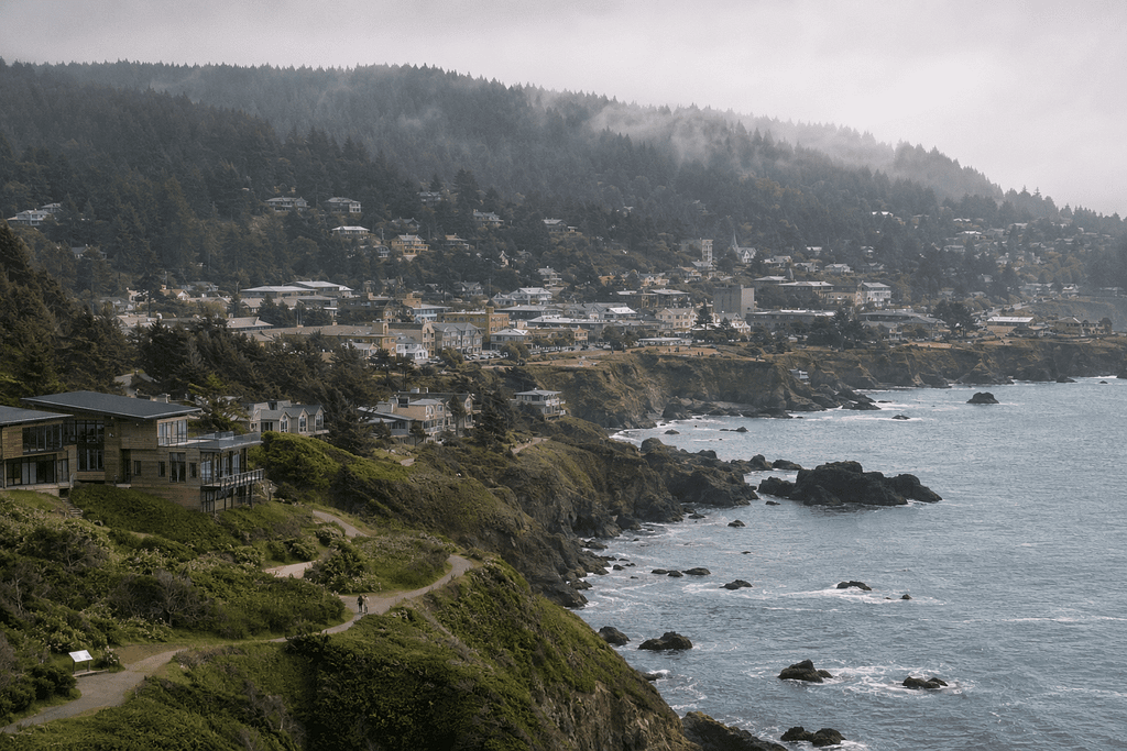 Bastinna, a temperate forested coastline of cliffs and hillside homes north of Morphelio
